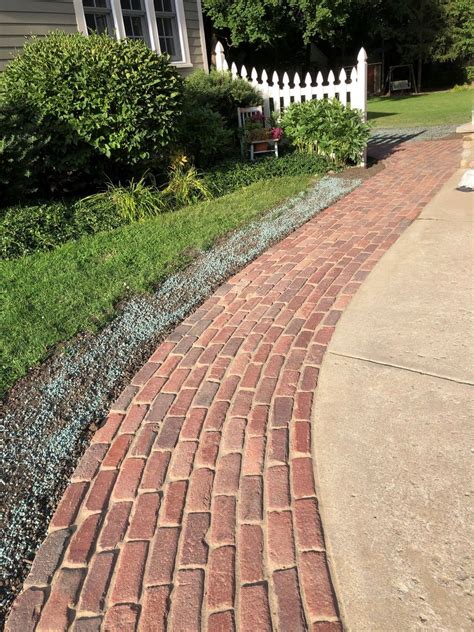 Brick edged bound gravel driveway smart and cleanlooking if you have