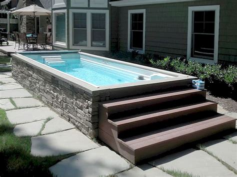 Edging around pool made of retaining wall pavers Backyard pool